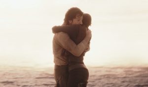 Cassian and Jyn embrace as the Death Star shock wave approaches them at the end of Rogue One