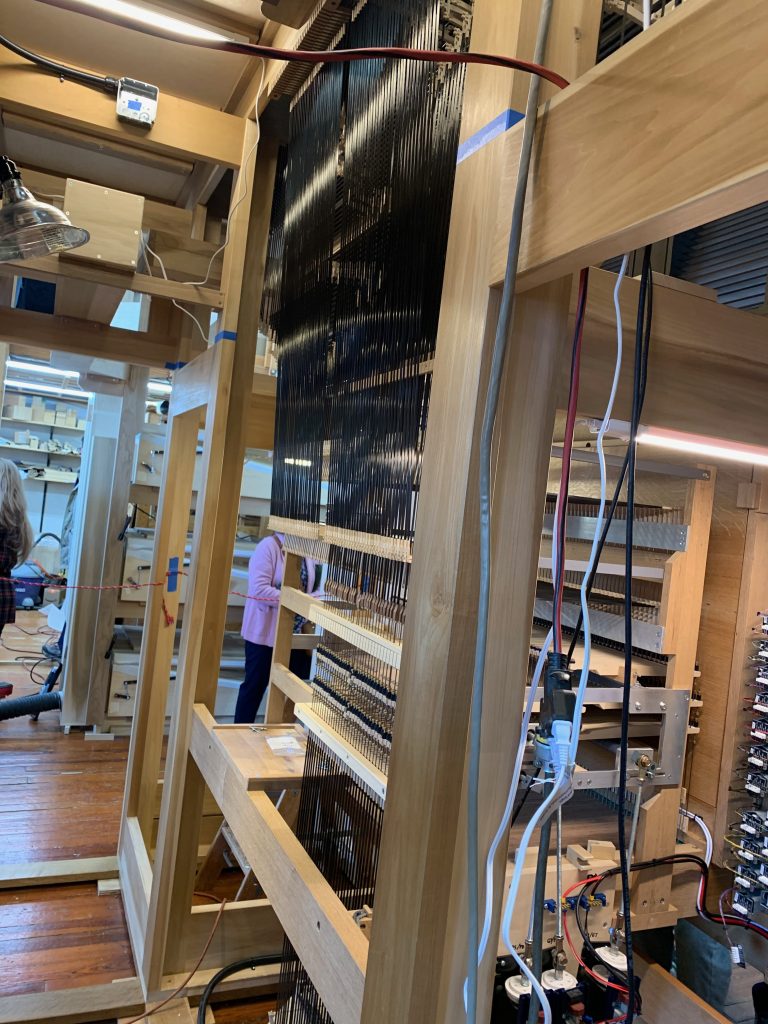 The back of the organ console, with thousands of cables connecting keys to pipes.